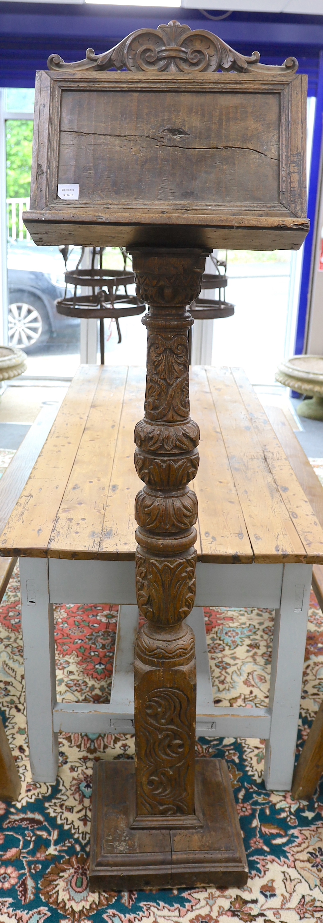 A walnut and elm lectern from Brede Place Chapel, height 190cm, Provenance- Brede Place, East Sussex, a former residence of the Frewen family from 1712-1936.